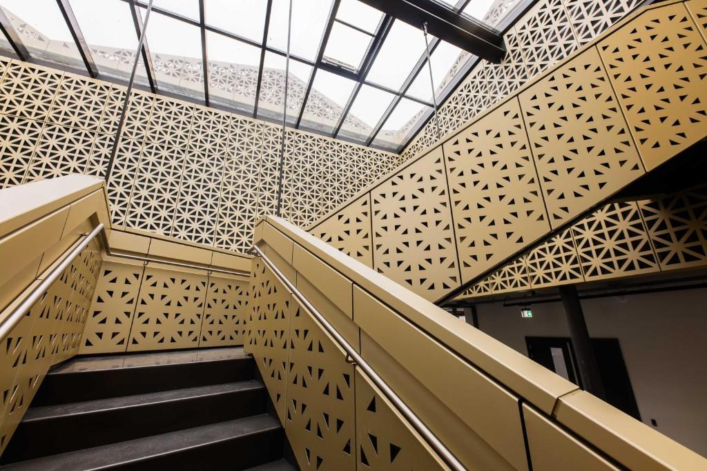 Staircase beneath the glass roof of the atrium at Brede Hilledijk 95